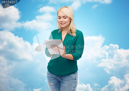 Image of smiling woman with tablet pc computer