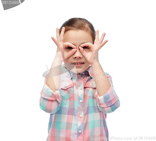 Image of happy little girl making faces and having fun