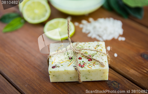 Image of close up of handmade herbal soap bar on wood