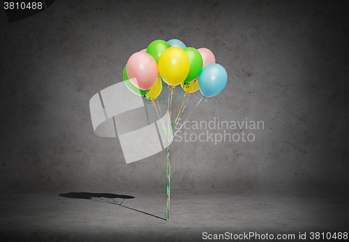 Image of bunch of colorful helium balloons