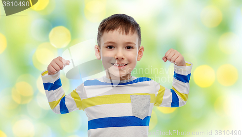 Image of happy smiling little boy with raised hand