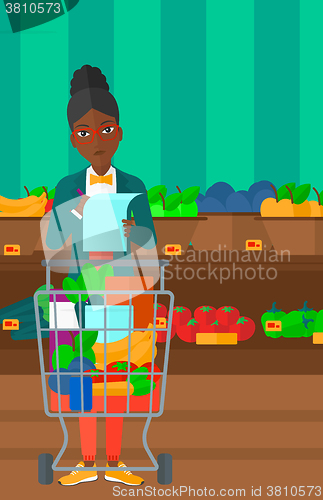 Image of Woman with shopping list. 