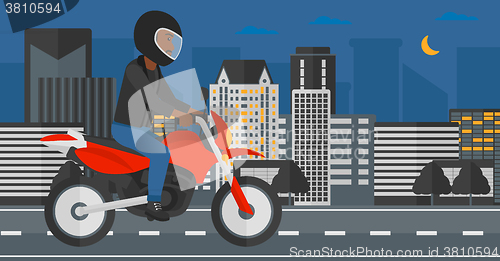 Image of Man riding motorcycle.