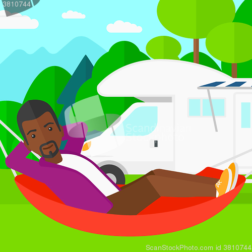 Image of Man lying in hammock.