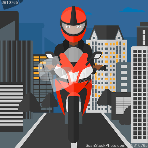 Image of Woman riding motorcycle.