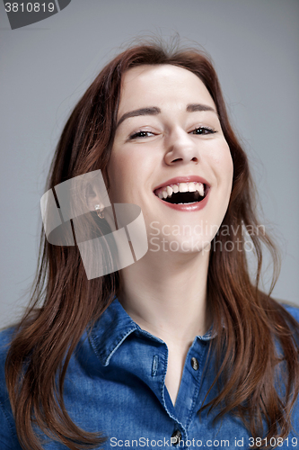 Image of The happy woman on gray background