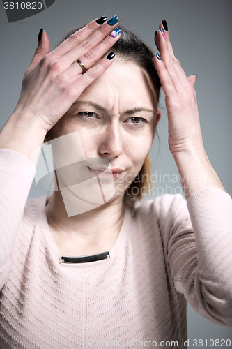 Image of The portrait of a beautiful sad girl closeup