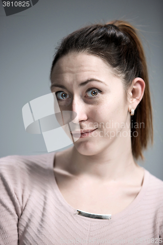 Image of The happy woman on gray background