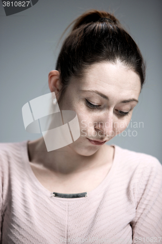 Image of The portrait of a beautiful sad girl closeup