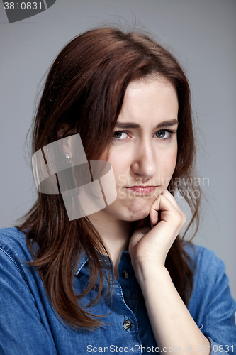 Image of The portrait of a beautiful sad girl closeup