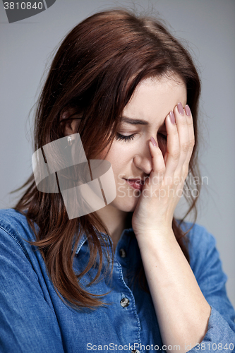 Image of The portrait of a beautiful sad girl closeup