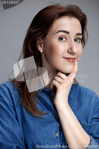 Image of The happy woman on gray background