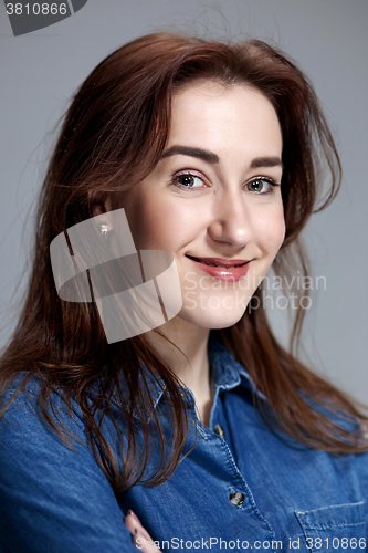 Image of The happy woman on gray background