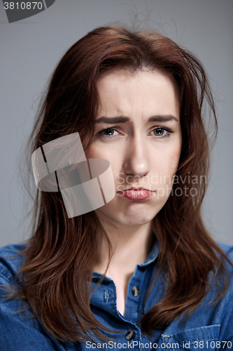 Image of The portrait of a beautiful sad girl closeup