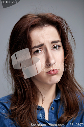 Image of The portrait of a beautiful sad girl closeup