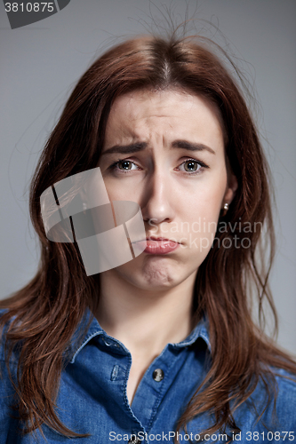 Image of The portrait of a beautiful sad girl closeup