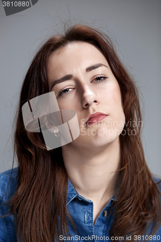 Image of The portrait of a beautiful sad girl closeup