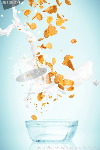 Image of The cornflakes falling with milk stream