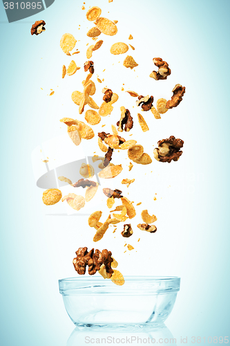 Image of The cornflakes falling with walnuts