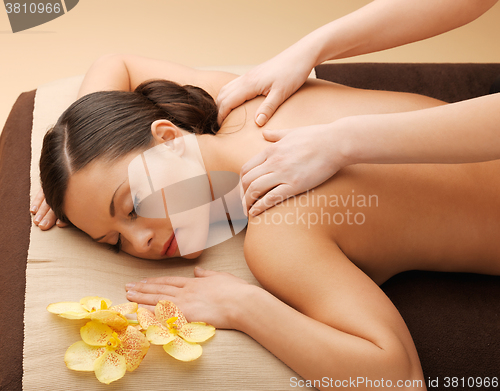 Image of beautiful woman in massage salon