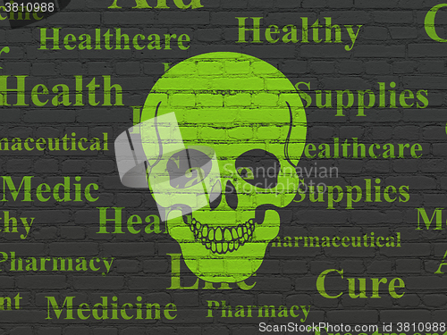 Image of Health concept: Scull on wall background