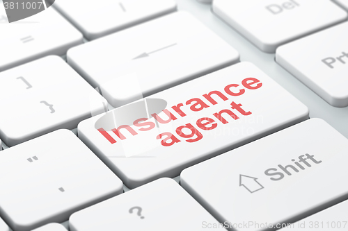 Image of Insurance concept: Insurance Agent on computer keyboard background