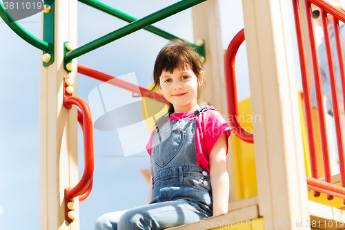 Image of happy little girl on children playground