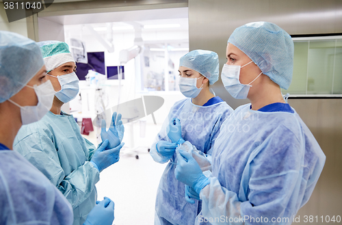 Image of group of surgeons in operating room at hospital