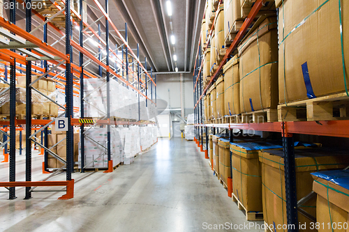 Image of cargo boxes storing at warehouse shelves