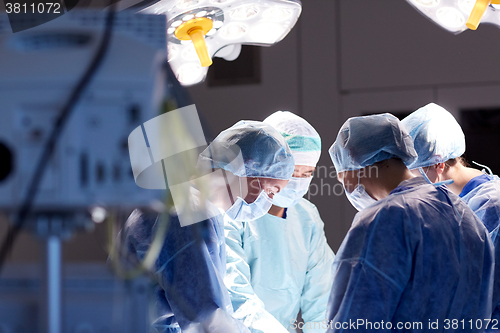 Image of group of surgeons in operating room at hospital