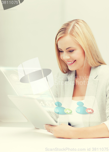 Image of businesswoman looking at tablet pc