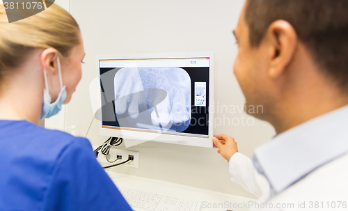 Image of close up of dentist and assistant at dental clinic