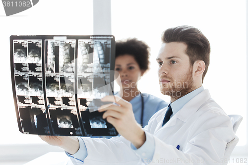 Image of doctor and nurse looking to  x-ray at hospital