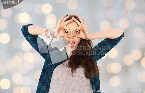 Image of happy teenage girl making face and having fun