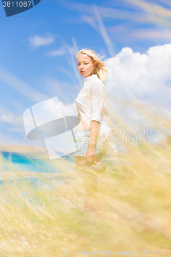 Image of Free Happy Woman Enjoying Sun on Vacations.