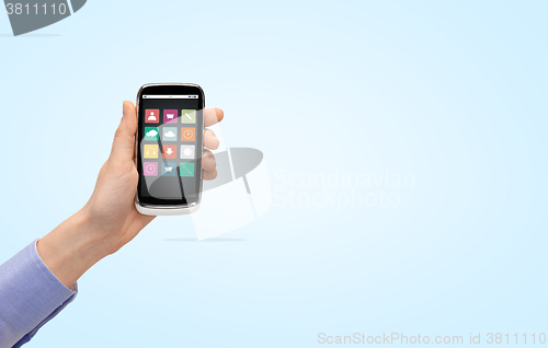 Image of close up of hand with smartphone menu icons