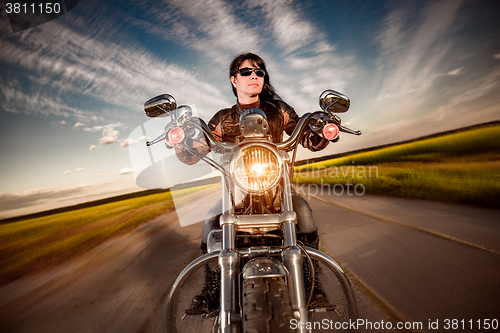 Image of Biker girl on a motorcycle