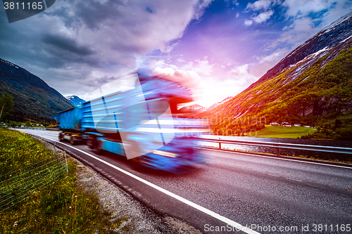 Image of Truck and highway at sunset