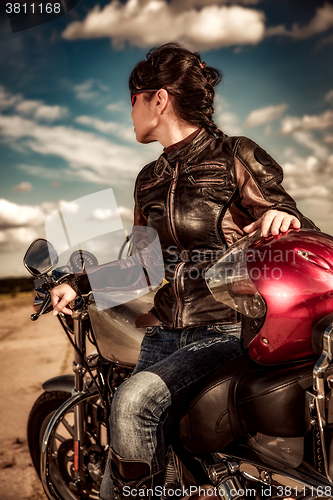 Image of Biker girl on a motorcycle
