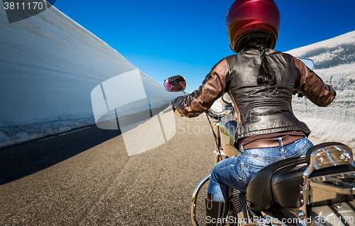 Image of Biker girl First-person view, mountain serpentine.