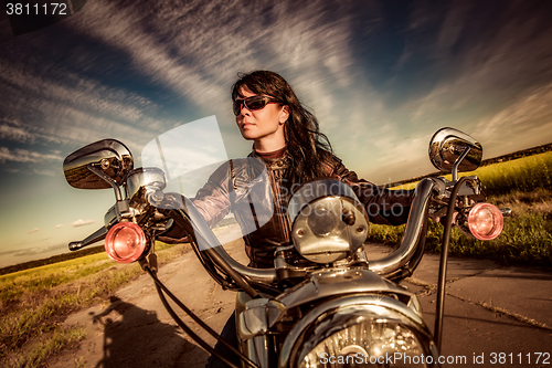 Image of Biker girl on a motorcycle