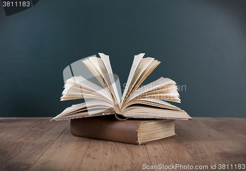 Image of Book in front of chalkboard