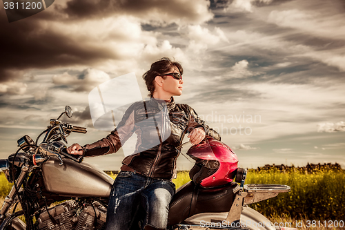 Image of Biker girl on a motorcycle