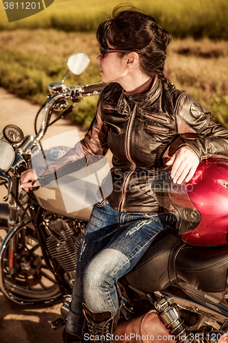 Image of Biker girl on a motorcycle