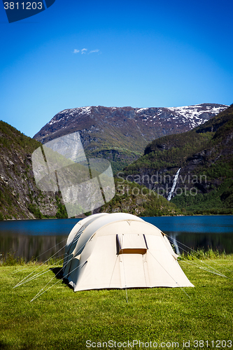 Image of Tourist tent on the shore of the lake.