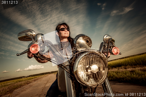 Image of Biker girl on a motorcycle