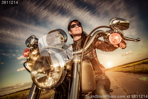 Image of Biker girl on a motorcycle