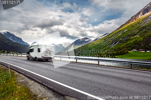 Image of Caravan car travels on the highway.