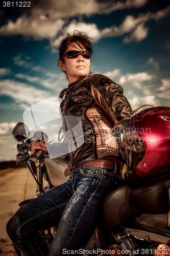 Image of Biker girl on a motorcycle