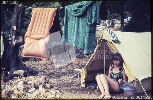 Image of Original vintage colour slide from 1960s, young woman sitting in